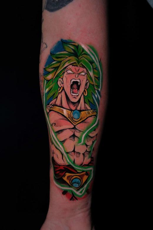 Anime colour forearm tattoo